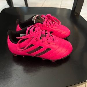 Kids pink and black adidas soccer cleats